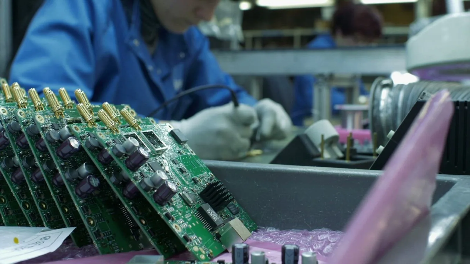 DeviceLab senior engineers testing prototype electronic boards on laboratory benches