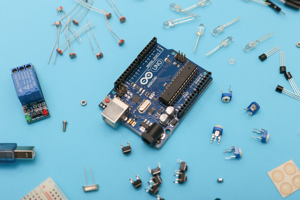 RS485 slave lock controller PCBA driving 16 to 24 channels of 12V 24V solenoid locks with hardware pulse-width cutoff timers protecting MOSFET drivers