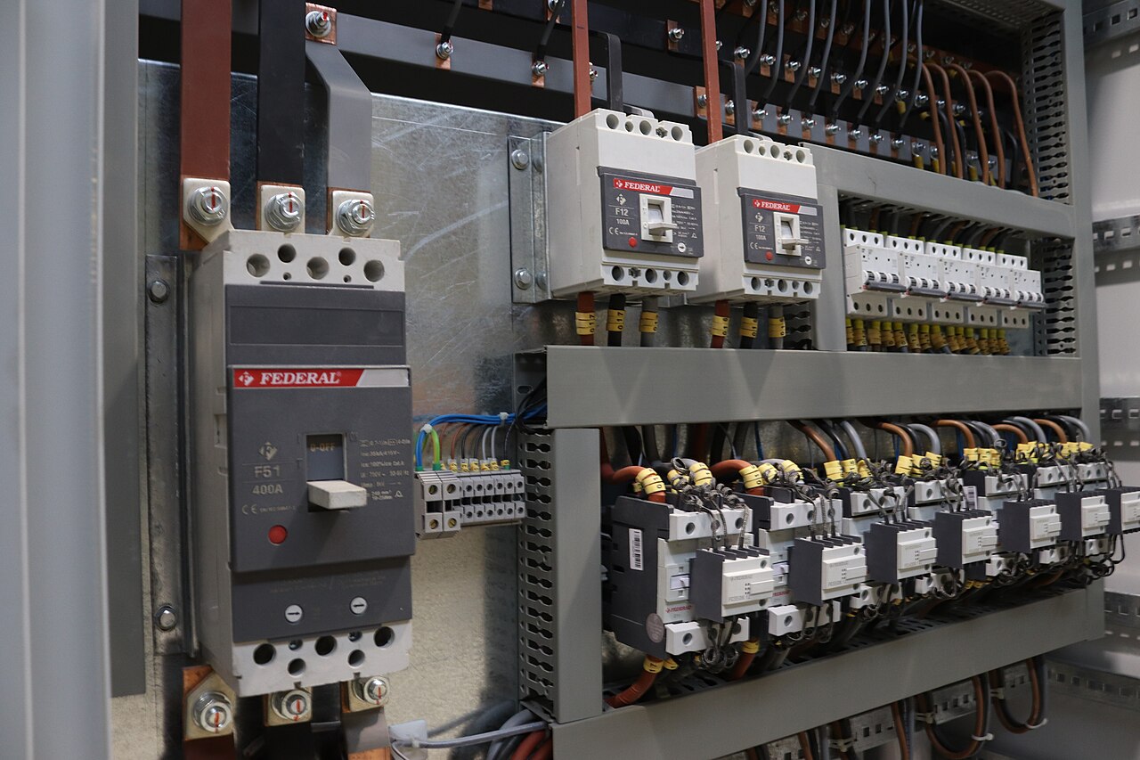 RO water pump and HVAC chiller electrical control panel with DIN-rail mounted DeviceLab DL-M400 and DL-LOG8 IoT module reading temperature and conductivity controllers